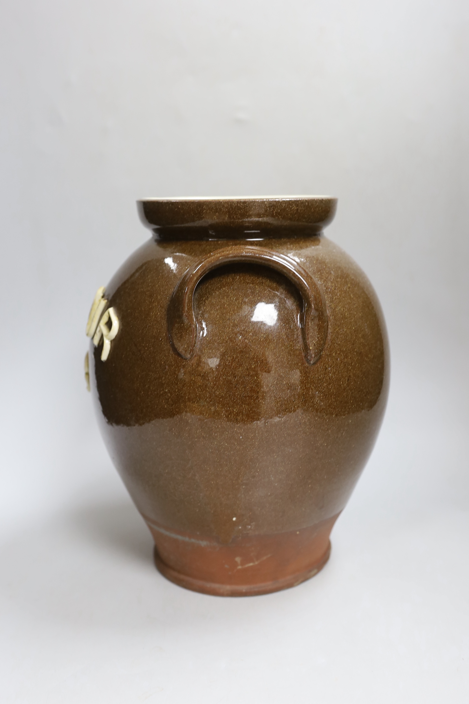 An early 20th century pottery jar inscribed ‘Flour B’, 30cm high